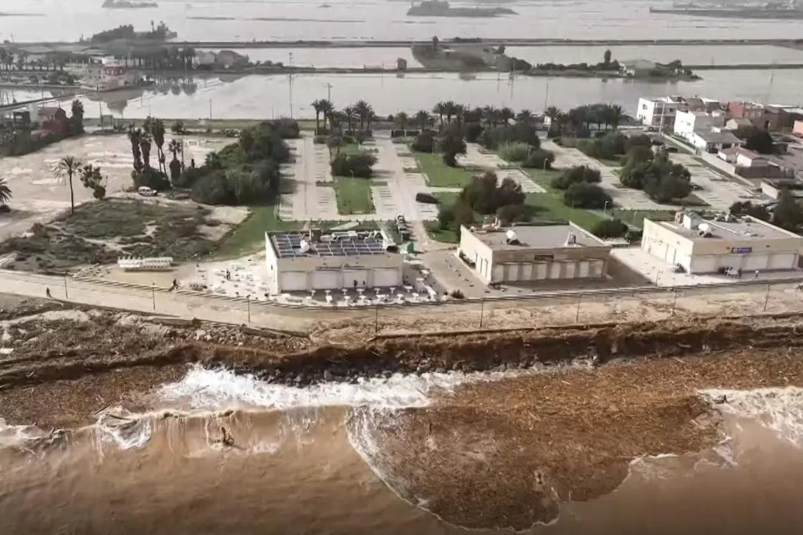 A river burst its banks in the flood-hit municipality of Paiporta, in the province of Valencia, Spain, on Oct 30. 