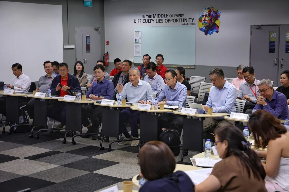 (From left) Strides Premier CEO Ang Wei Neng, Strides Holdings president Tan Peng Kuan, SMRT Trains president Lam Sheau Kai, SMRT Group CEO Ngien Hoon Ping, SMRT chairman Seah Moon Ming, SMRT Group CFO Phua Yung Keat, Stellar Lifestyle president Tony Heng and SMRT Group chief engineering officer Ang Hang Guan at the Bishan Depot Admin Building on Aug 5.