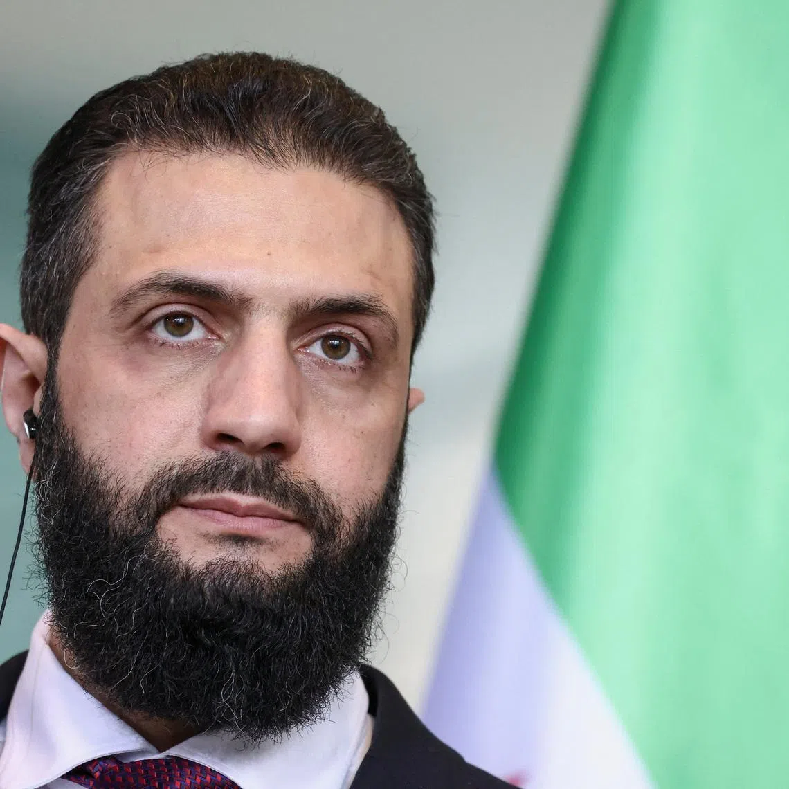 Syrian President Ahmed al-Sharaa speaks as he holds a press conference with German Chancellor Friedrich Merz at the Chancellery, in Berlin, Germany, March 30, 2026. REUTERS/Nadja Wohlleben/File Photo