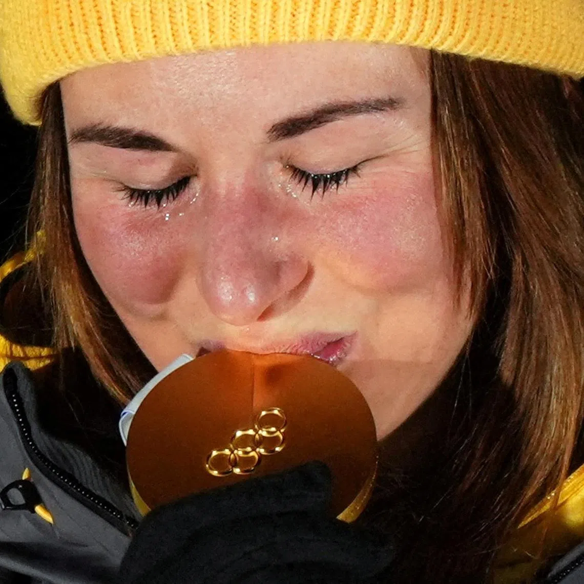 Milano Cortina 2026 Olympics - Luge - Women's Singles Victory Ceremony - Cortina Sliding Centre, Cortina d'Ampezzo, Italy - February 10, 2026. Gold medallist Julia Taubitz of Germany celebrates on the podium during the women's singles victory ceremony REUTERS/Aleksandra Szmigiel