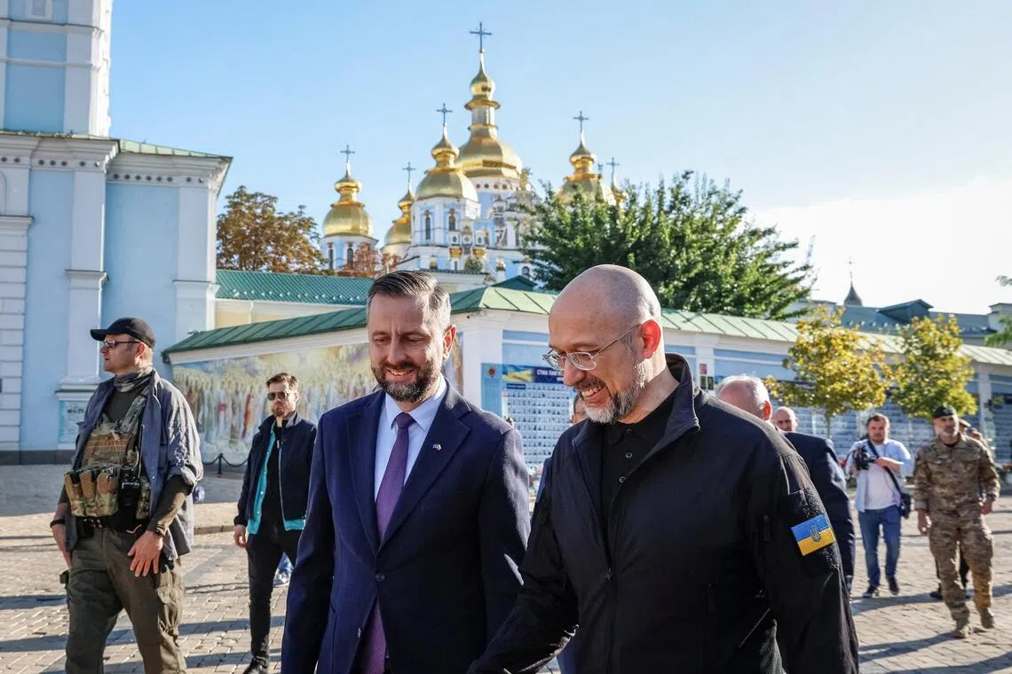 Polish Deputy Prime Minister and Defence Minister Wladyslaw Kosiniak-Kamysz (left) and Ukrainian Defence Minister Denys Shmyhal walking in Kyiv on Sept 18.