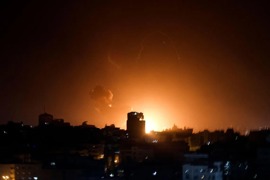 Fire and smoke rise above buildings in Gaza City as Israel launched air strikes on the Palestinian enclave early on Feb 2, 2023. 
