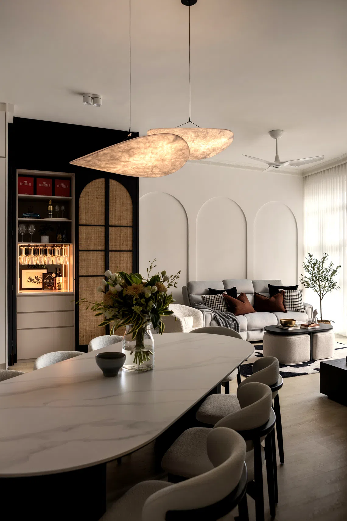A custom-made 2.4m-long sintered-stone table anchors the dining area.