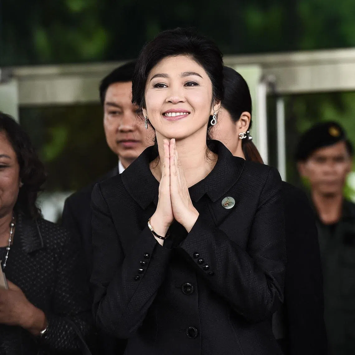 Former premier Yingluck Shinawatra was sentenced in absentia to five years in jail for failing to stop the fake, corruption-plagued government-to-government rice deal.