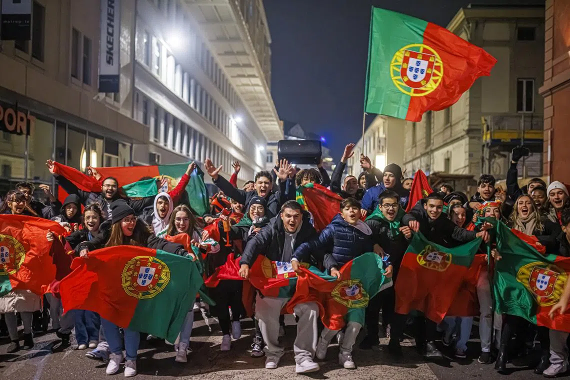 Portuguese fans celebrate after the FIFA World Cup Qatar 2022 round of 16 soccer match between Portugal and Switzerland in the streets of Lausanne, Switzerland, Dec 6, 2022. 