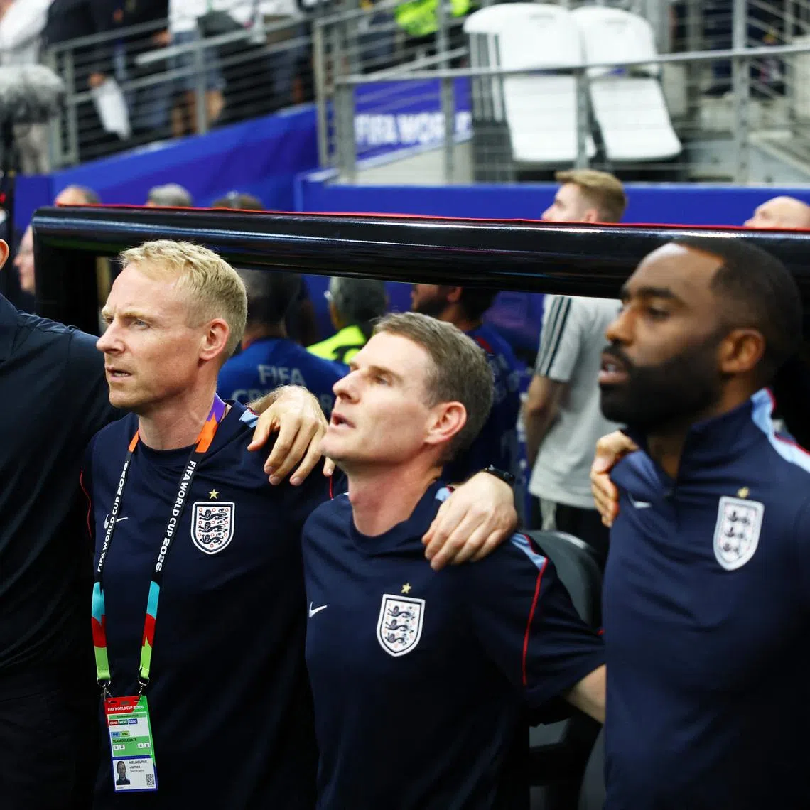 Soccer Football - FIFA World Cup 2026 - Group L - England v Croatia - Dallas Stadium, Arlington, Texas, U.S. - June 17, 2026 England manager Thomas Tuchel and his coaching during the national anthems before the match REUTERS/Kai Pfaffenbach