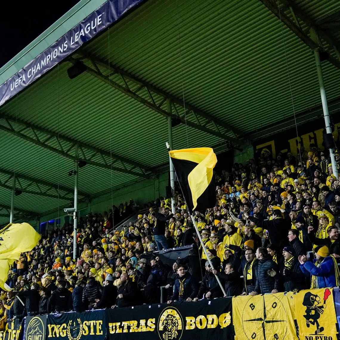 Soccer - UEFA Champions League - Round of 16 - First Leg - Bodo/Glimt v Sporting CP - Aspmyra Stadion, Bodo, Norway - March 11, 2026 Bodo/Glimt fans in the stands before the match Fredrik Varfjell/NTB via REUTERS