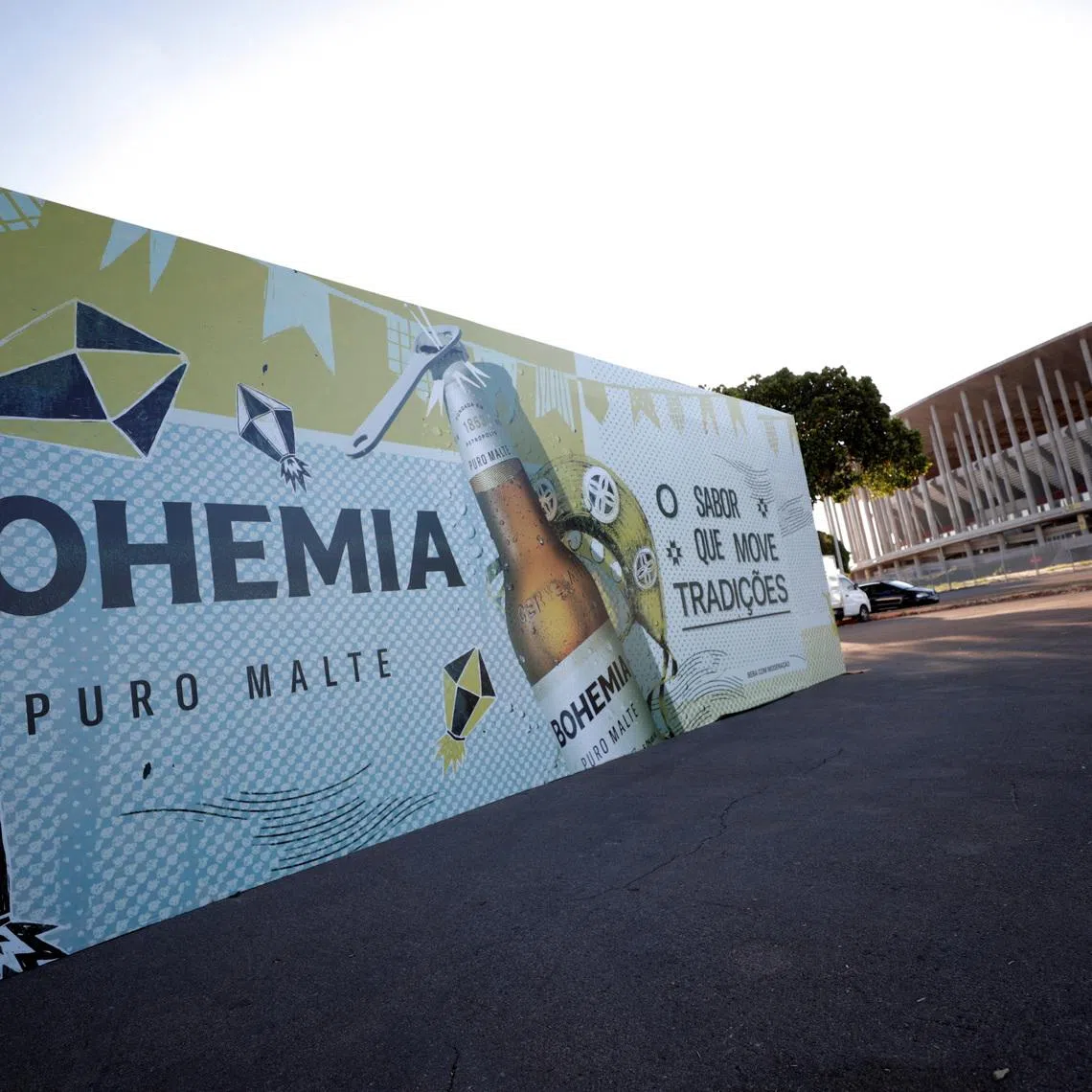 FILE PHOTO: A booth of Bohemia beer produced by Brazil-based Ambev, is mounted in front of the stadium of the Mane Garrincha National Stadium in Brasilia, Brazil June 9, 2021. REUTERS/Ueslei Marcelino/File Photo