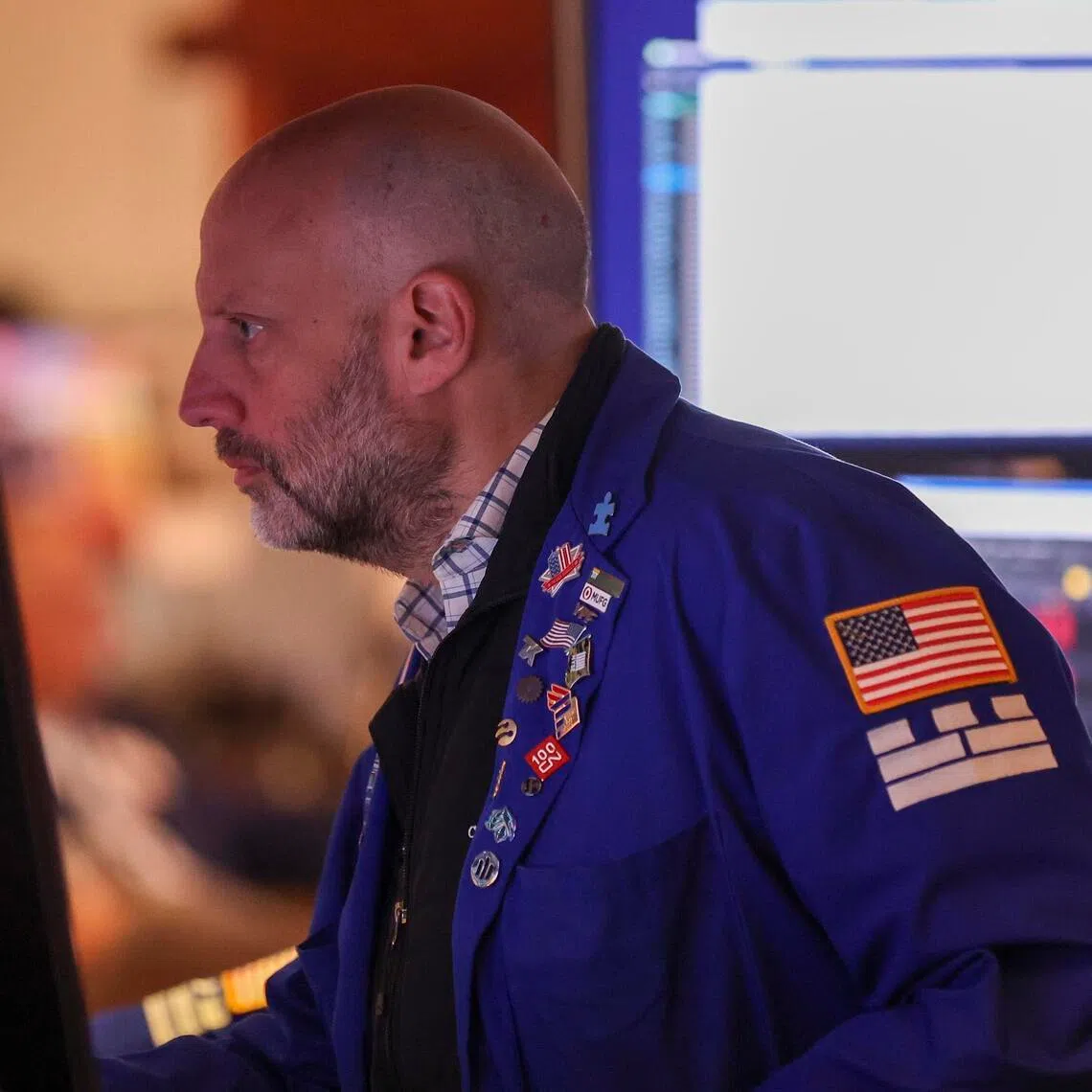 A trader working on the floor of the New York Stock Exchange, in New York City.