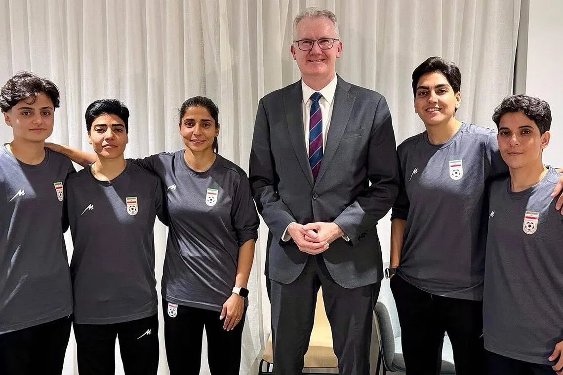 Australia's Home Affairs minister Tony Burke with five Iranian women footballers who applied for asylum after the Asian Cup.