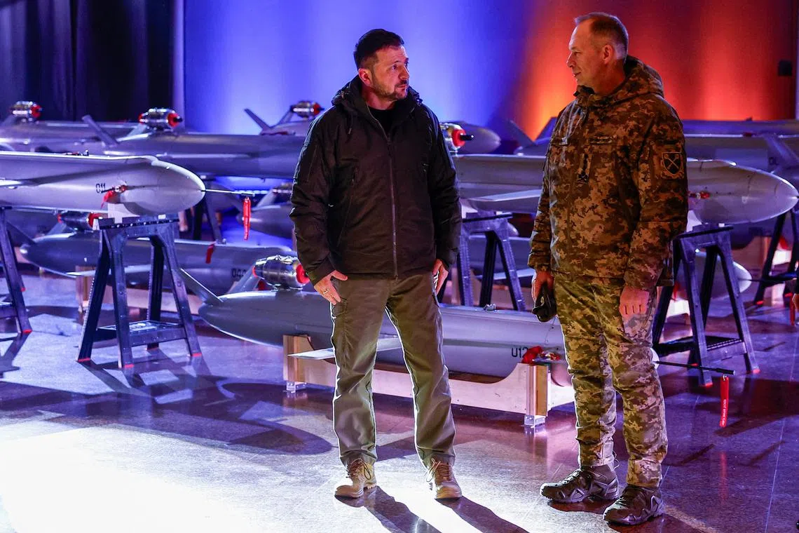 FILE PHOTO: Ukraine's President Volodymyr Zelenskiy and Commander in Chief of the Ukrainian Armed Forces Colonel General Oleksandr Syrskyi visit an exhibition of new Ukrainian made drone-missiles Peklo dedicated to the Day of Ukrainian Armed Forces, amid Russia's attack on Ukraine, in Kyiv, Ukraine December 6, 2024. REUTERS/Valentyn Ogirenko/File Photo