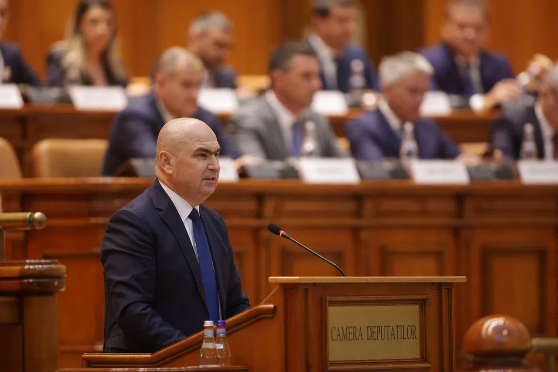 Romania's designated Prime Minister Ilie Bolojan delivers a speech at the start of a joint parliamentary session, ahead of a vote of confidence in his coalition, in Bucharest, Romania, June 23, 2025. Inquam Photos/George Calin via REUTERS