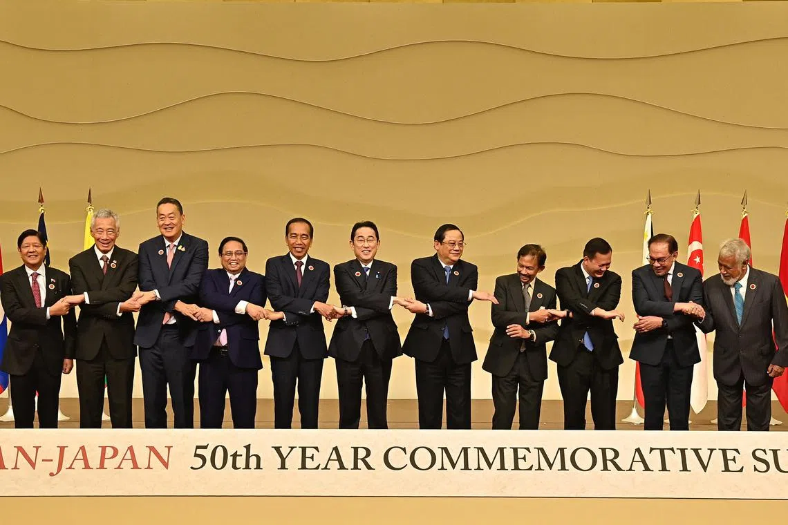 PM Lee Hsien Loong (second from left) and other leaders of Asean nations, except Myanmar, posing for a group photo with Japanese PM Fumio Kishida (centre) at a commemorative summit in Tokyo on Dec 17.