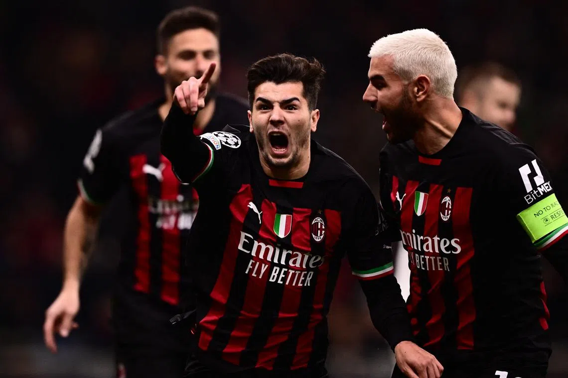 AC Milan's Spanish midfielder Brahim Diaz (centre) celebrates with defender Theo Hernandez after opening the scoring.