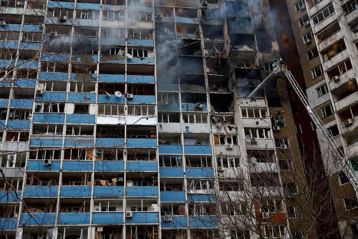 Firefighters work at a site of a building damaged during a Russian missile strike, amid Russia's attack on Ukraine, in Kyiv, Ukraine February 7, 2024. REUTERS/Valentyn Ogirenko/File Photo