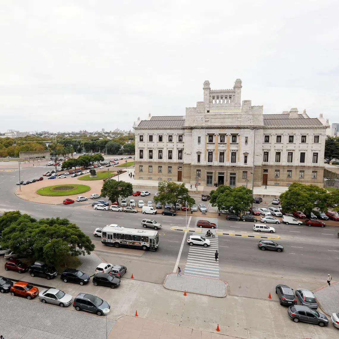 People walk in front of Uruguay's Palacio Legislativo in Montevideo, Uruguay April 23, 2019.  REUTERS/Andres Stapff/File Photo