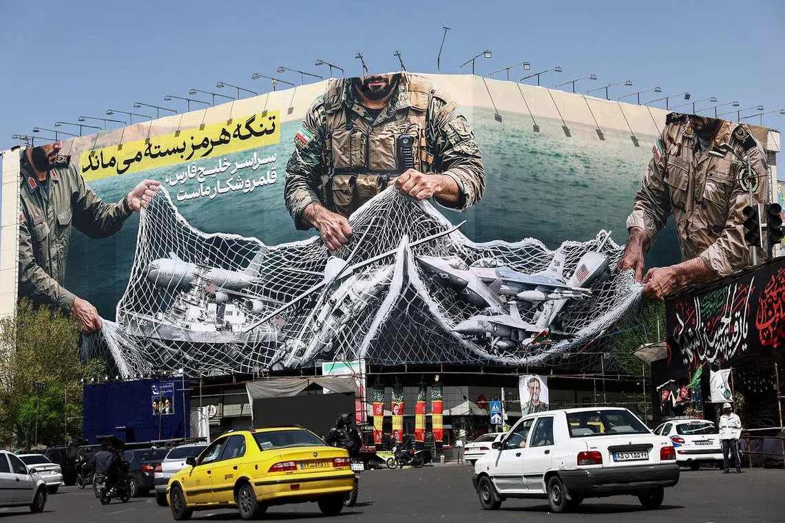 Cars drive near an anti-U.S. bilboard, amid the U.S.-Israeli conflict with Iran, in Tehran, Iran, April 5, 2026. Majid Asgaripour/WANA (West Asia News Agency) via REUTERS ATTENTION EDITORS - THIS PICTURE WAS PROVIDED BY A THIRD PARTY TPX IMAGES OF THE DAY
