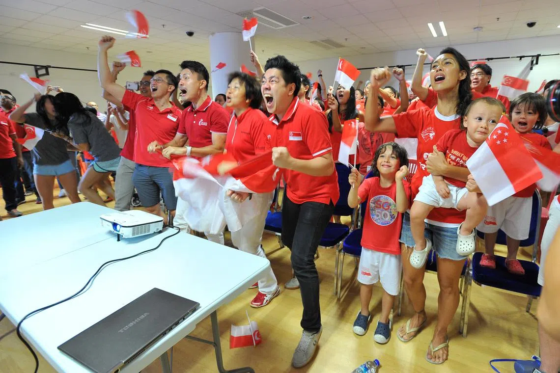Members of Singapore’s sporting fraternity celebrating at the OCBC Aquatic Centre during a screening of Joseph Schooling’s 100m butterfly race at the Rio Olympics on Aug 13, 2016. His unprecedented victory has captured the imagination of the nation and may inspire more young athletes to hone their potential in sport, just as he was motivated by American swimmer Michael Phelps.