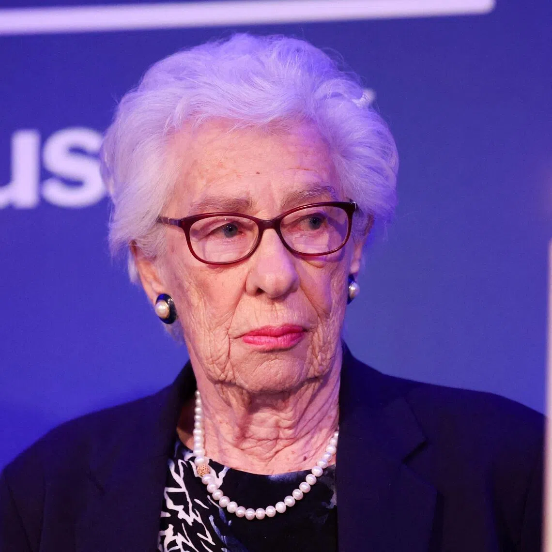 (FILES) Eva Schloss, the step-sister of Anne Frank and honorary president of the Anne Frank Trust UK, takes part in a candle lighting ceremony during a reception to mark holocaust memorial day and the 75th publication of Anne Franks diary for the Anne Frank Trust in London on January 20, 2022. Eva Schloss, an Auschwitz survivor who dedicated decades to educating people on the Holocaust and was the step-sister of diarist Anne Frank, has died aged 96, her foundation announced on January 4, 2026. (Photo by Chris Jackson / POOL / AFP)