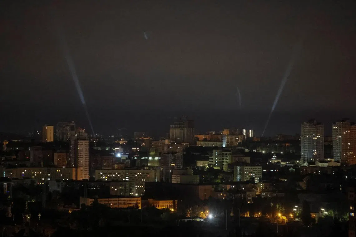 Ukrainian servicemen use a searchlight as they search for drones in the sky over the city during a Russian drone and missile strike, amid Russia's attack on Ukraine in Kyiv on May 29, 2023. 