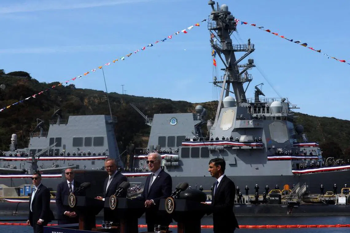 FILE PHOTO: U.S. President Joe Biden, Australian Prime Minister Anthony Albanese and British Prime Minister Rishi Sunak deliver remarks on the Australia- United Kingdom- U.S. (AUKUS) partnership, after a trilateral meeting, at Naval Base Point Loma in San Diego, California U.S. March 13, 2023. REUTERS/Leah Millis/File photo