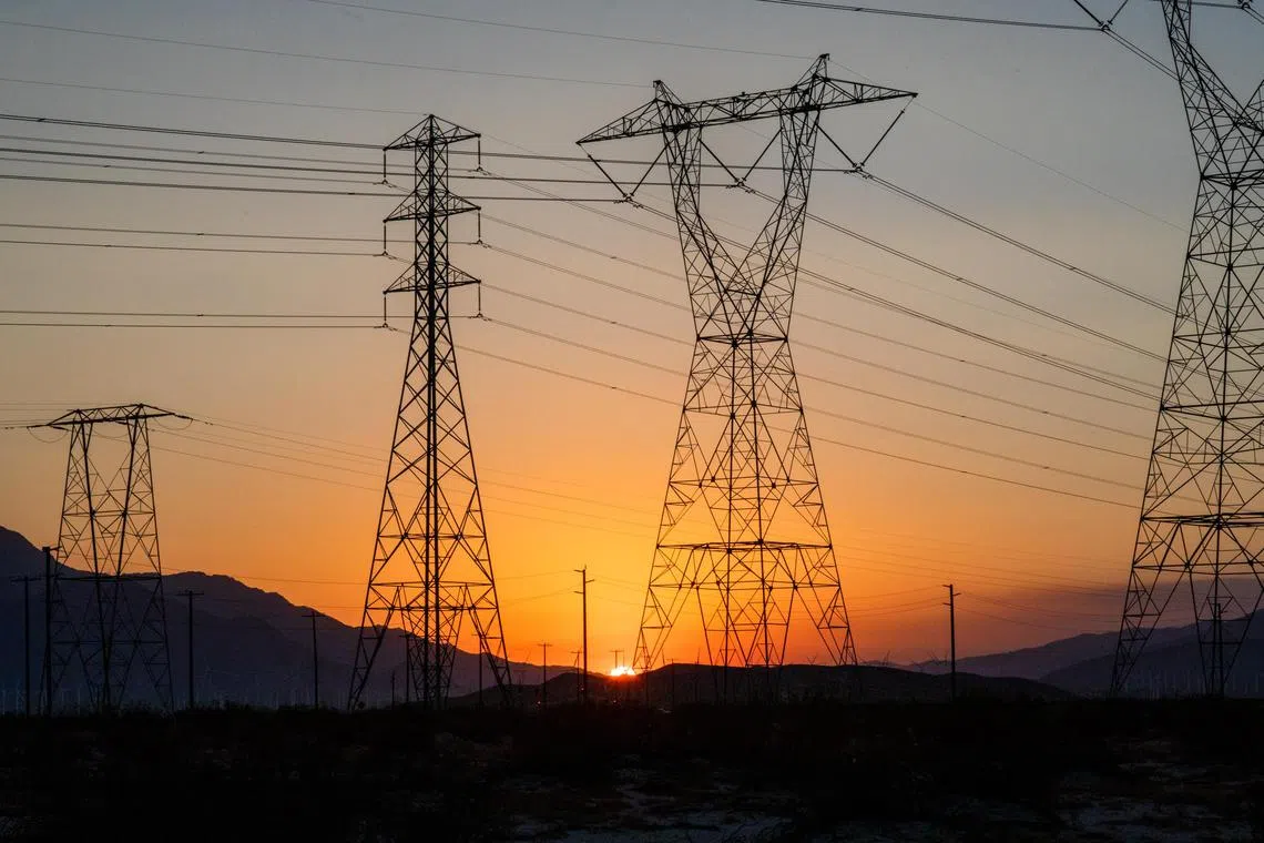 FILE — Power lines in Cathedral City, Calif., Sept. 6, 2022. Even as technologies like wind, solar and electric cars spread, nations are falling far behind in building the power lines needed to support them. (Alex Welsh/The New York Times)