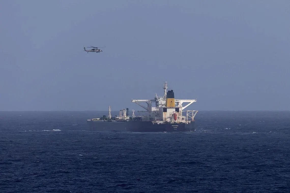 In an image provided by the Department of Homeland Security, a U.S. military helicopter flies over the Panama-flagged Centuries, which was intercepted on Saturday, Dec. 20, 2025, east of Barbados in the Caribbean Sea. The U.S. Coast Guard on Saturday tried to intercept an oil tanker linked to Venezuela that is now fleeing away from the Caribbean Sea, according to three U.S. officials who spoke on the condition of anonymity to discuss a sensitive operation, days after President Donald Trump said he would crack down on sanctioned vessels involved in the country’s oil trade. (Department of Homeland Security via The New York Times) — NO SALES; FOR EDITORIAL USE ONLY. —