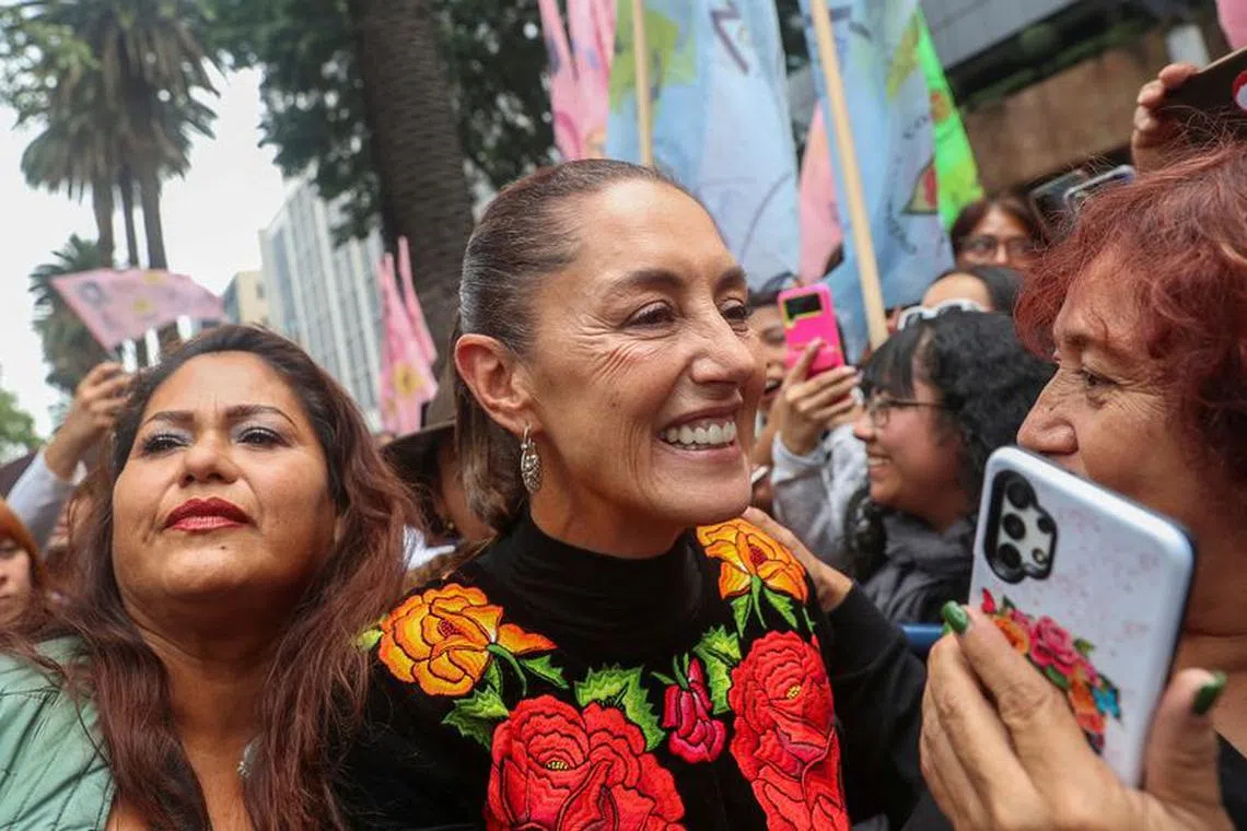 FILE PHOTO: Former Mexico City Mayor Claudia Sheinbaum greets supporters during an event, pursuing to be the ruling MORENA party's candidate for the 2024 presidential election, in Mexico City, Mexico, August 26, 2023. REUTERS/Raquel Cunha/File Photo