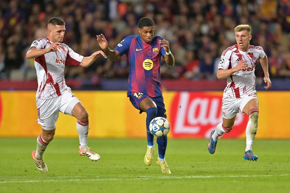 Barcelona's Marcus Rashford controls the ball during the Champions League match against Olympiacos.