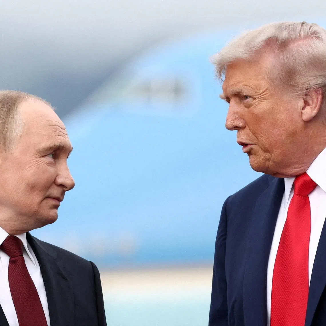 FILE PHOTO: U.S. President Donald Trump speaks with Russian President Vladimir Putin, as they meet to negotiate for an end to the war in Ukraine, at Joint Base Elmendorf-Richardson in Anchorage, Alaska, U.S., August 15, 2025. REUTERS/Kevin Lamarque/File Photo