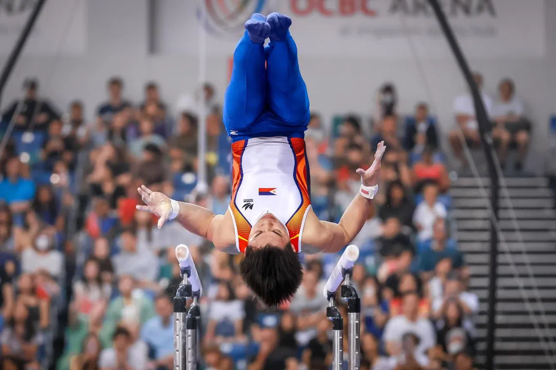 The Philippines’ Carlos Yulo on his way to winning a bronze in the men’s parallel bars at the Asian Artistic Gymnastics Championships at OCBC Arena, June 28, 2023. He also won three gold medals and a silver.