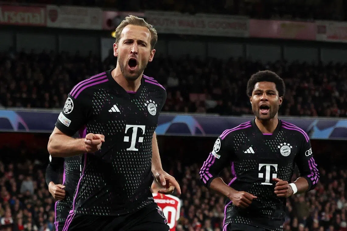 Soccer Football - Champions League - Quarter Final - First Leg - Arsenal v Bayern Munich - Emirates Stadium, London, Britain - April 9, 2024 Bayern Munich's Harry Kane celebrates scoring their second goal with Serge Gnabry REUTERS/David Klein