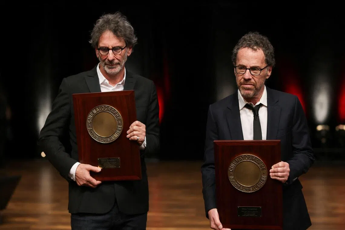 Film-maker brothers Joel (left) and Ethan Coen with their Prix Lumiere 2026 award during the Lumiere Film Festival in Lyon, France, on Oct 16.