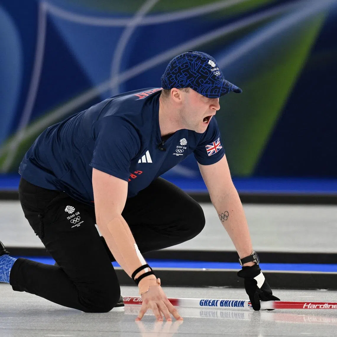 Milano Cortina 2026 Olympics - Curling - Mixed Doubles Round Robin Session 1 - Great Britain vs Norway - Cortina Curling Olympic Stadium, Cortina d'Ampezzo, Italy - February 04, 2026. Bruce Mouat of Britain reacts REUTERS/Jennifer Lorenzini