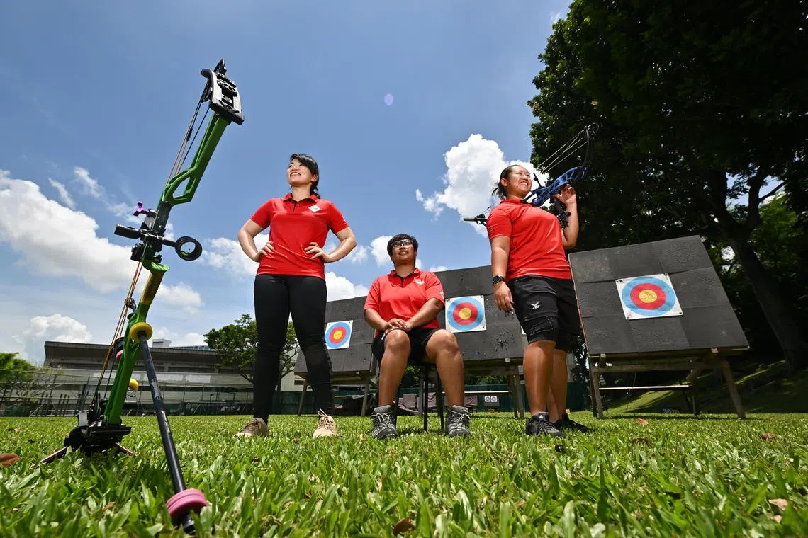 (From left) Ms Contessa Loh, 28, national team archer; Ms Nur Syahidah Alim, 37, national team paralympic archer; and Ms Madeleine Ong, 28, national team archer; at the range of Archery Association of Singapore on Mar 30, 2023.