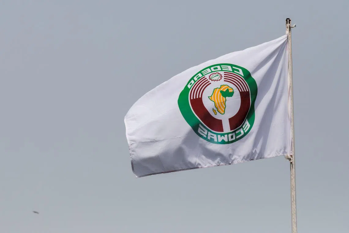 Economic Community of West African States (ECOWAS) flag is pictured during an extraordinary summit of ECOWAS to hear reports from recent missions to Mali, Burkina Faso and Guinea following military coups in those countries, in Accra, Ghana March 25, 2022. REUTERS/Francis Kokoroko/File Photo