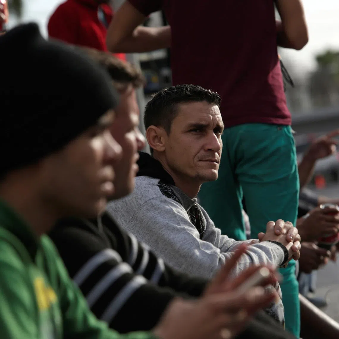 Cubans stranded in Mexico stand outside the border bridge after Washington repealed a measure granting automatic residency to virtually every Cuban who arrived in the United States, in Nuevo Laredo, Mexico January 25, 2017. REUTERS/Daniel Becerril