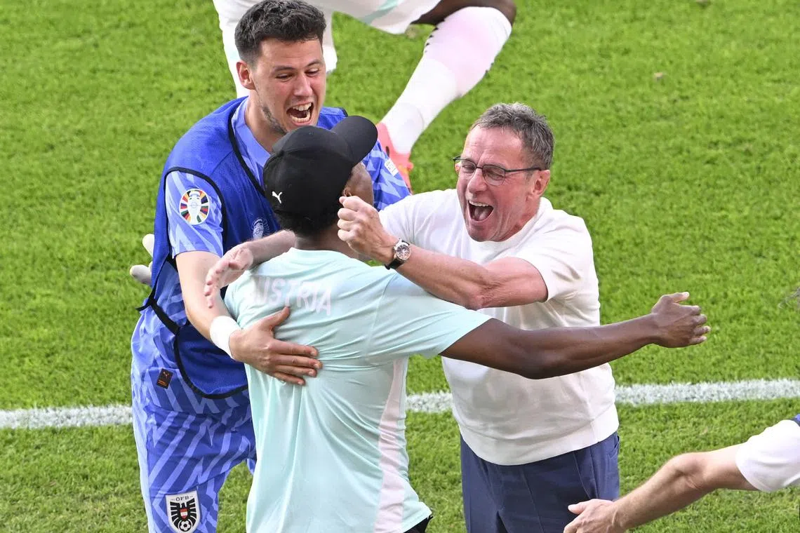 Soccer Football - Euro 2024 - Group D - Netherlands v Austria - Berlin Olympiastadion, Berlin, Germany - June 25, 2024 Austria coach Ralf Rangnick and David Alaba celebrate after the match REUTERS/Fabian Bimmer