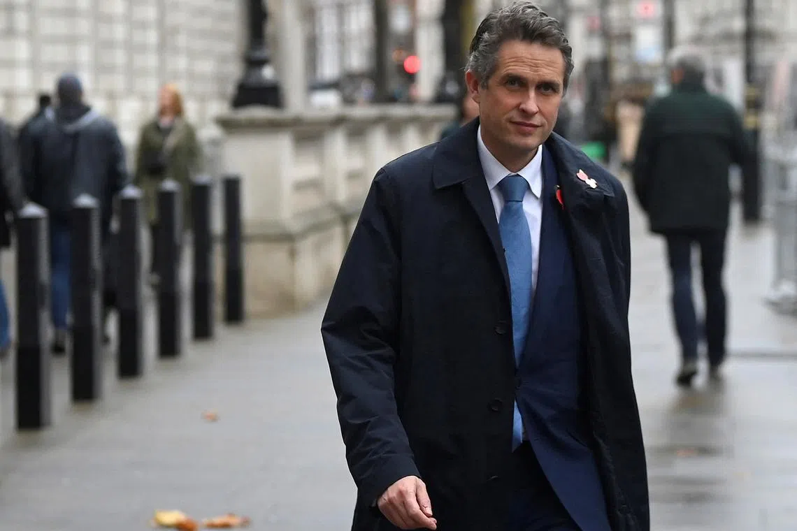 Gavin Williamson walks along Whitehall in London, on Nov 7, 2022.