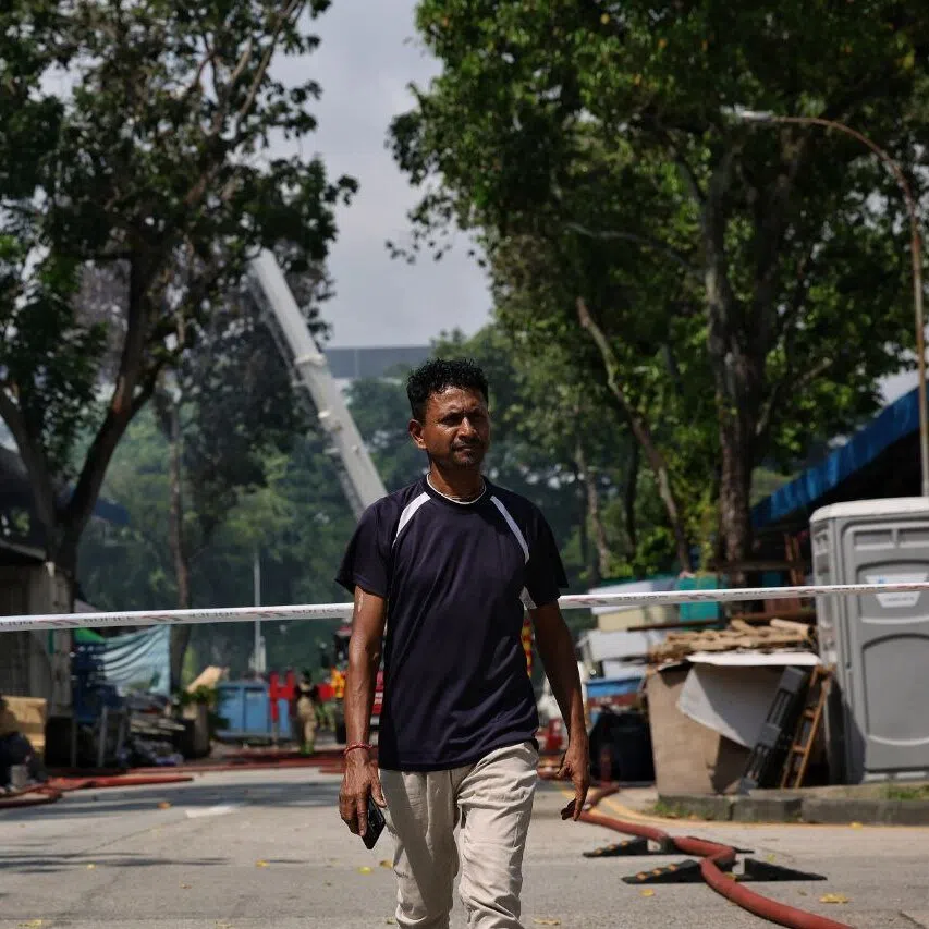 Mr Jhantu Ghosh returning to the scene to check on the situation at 1079 Eunos Avenue 7 on Nov 2.