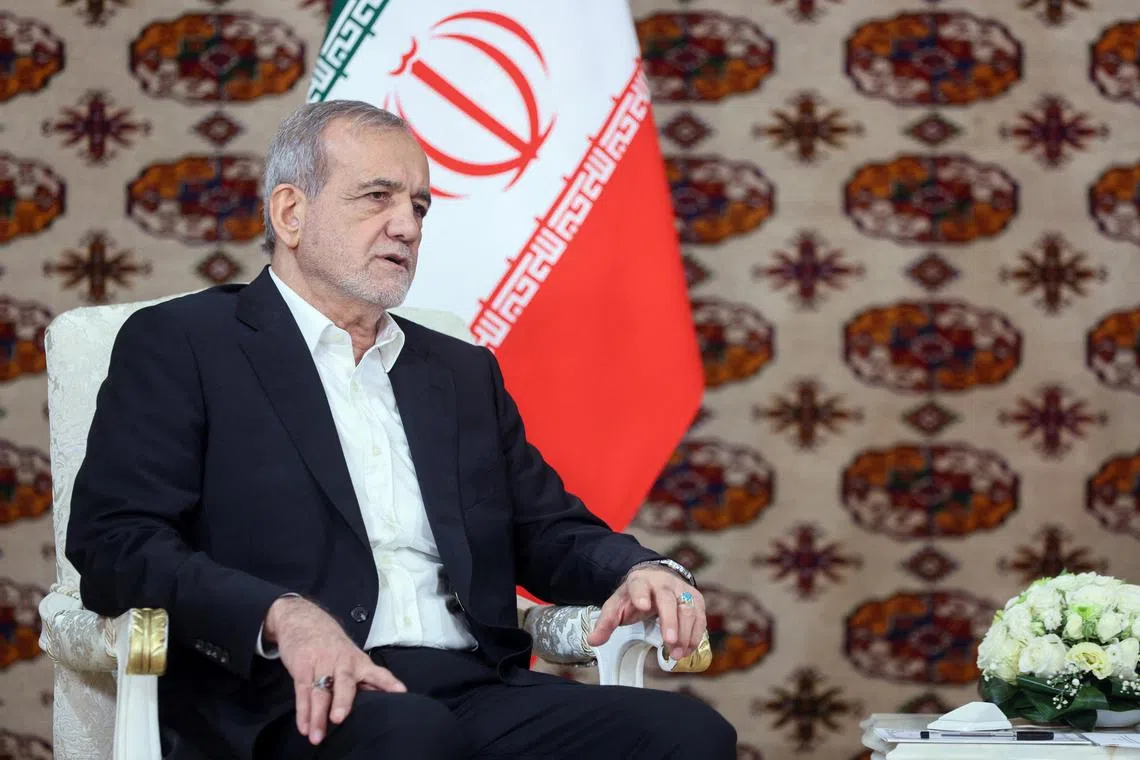 Iranian President Masoud Pezeshkian meets with his Russian counterpart Vladimir Putin  (Not pictured) on the sidelines of a cultural forum dedicated to the 300th anniversary of the birth of the Turkmen poet and philosopher Magtymguly Fragi, in Ashgabat, Turkmenistan October 11, 2024.  Sputnik/Alexander Scherbak/Pool via REUTERS