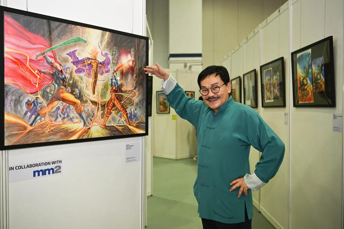 ST20221210-202237156489-Lim Yaohui-Charmaine Lim-cltony/
Tony Wong, forefather of Hong Kong martial arts comics, posing with his works at Sands Expo and Convention Centre on Dec 10, 2022.
Tony Wong, forefather of Hong Kong martial arts comics, will be at Singapore Comic Con this weekend to discuss meet fans and be part of a special gallery of his works over the years.
(ST PHOTO: LIM YAOHUI)