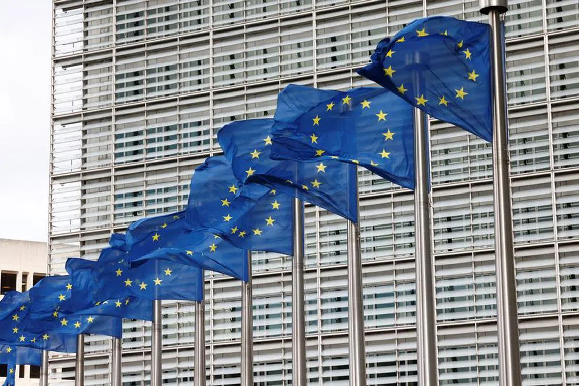 European Union flags flutter outside the EU Commission headquarters in Brussels, Belgium, September 28, 2022. REUTERS/Yves Herman/File Photo