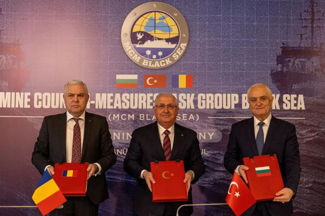 Turkish Defence Minister Yasar Guler, his Romanian counterpart Angel Tilvar and Bulgaria's Deputy Defence Minister Atanas Zapryanov attend a signing ceremony of a memorandum of understanding on establishing a mine countermeasures naval group in the Black Sea, aimed at clearing mines floating there as a result of the war in Ukraine, in Istanbul, Turkey, January 11, 2024. REUTERS/Umit Bektas