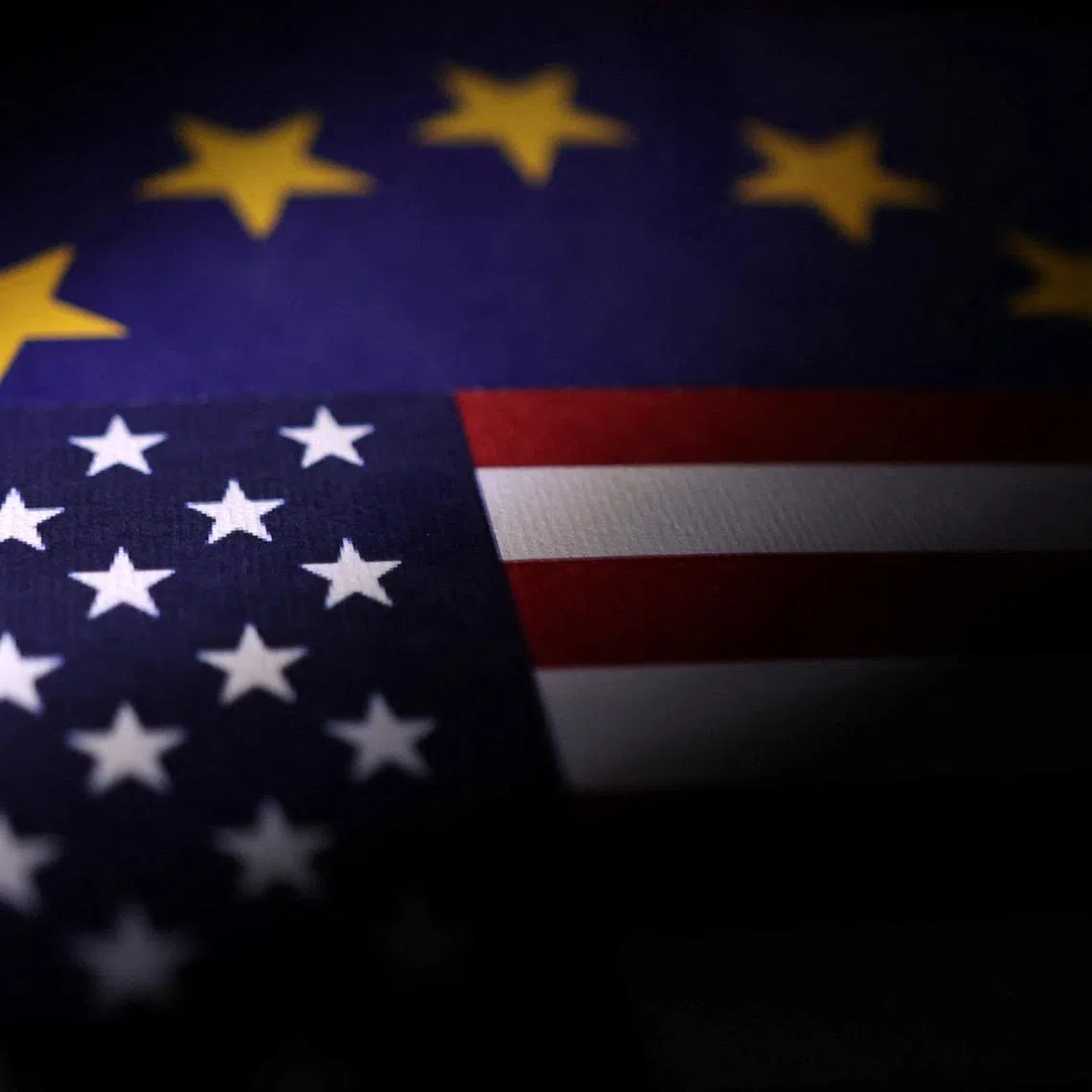 U.S. and European Union flags are seen in this illustration taken April 10, 2025. REUTERS/Dado Ruvic/Illustration