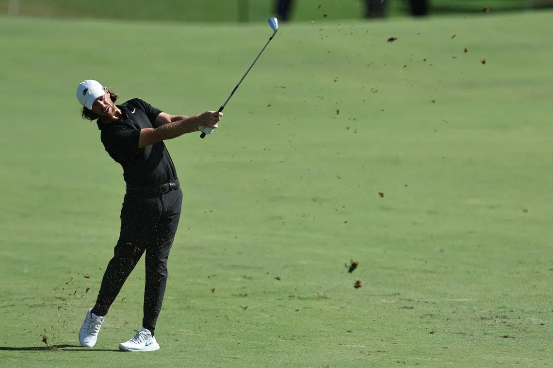 England's Tommy Fleetwood plays a shot during the DP World Tour Championship golf tournament in Dubai, on Nov 16, 2024.