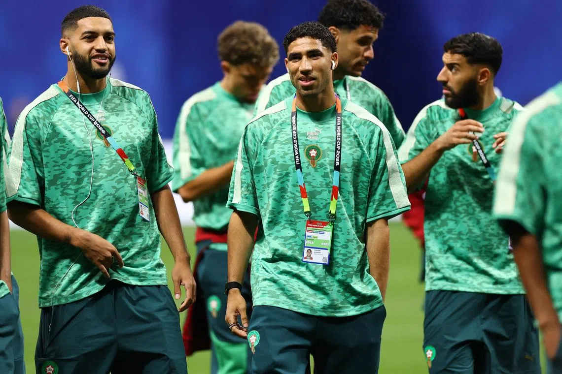 Soccer Football - FIFA World Cup 2026 - Group C - Morocco v Haiti - Atlanta Stadium, Atlanta, Georgia, U.S. - June 24, 2026 Morocco's Achraf Hakimi and Ismael Saibari walk on the pitch before the match REUTERS/Claudia Greco