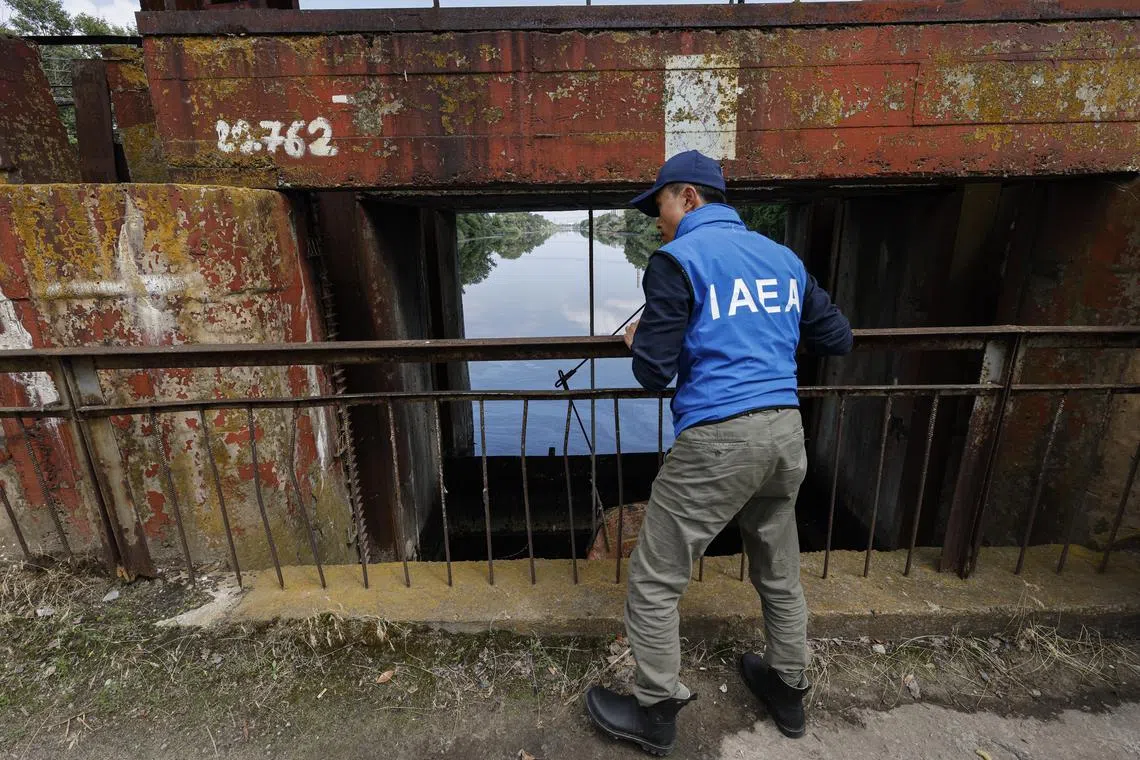 An IAEA expert inspects the reservoir that cools Ukraine's Zaporizhzhia Nuclear Power Plant, in Enerhodar, southeastern Ukraine.