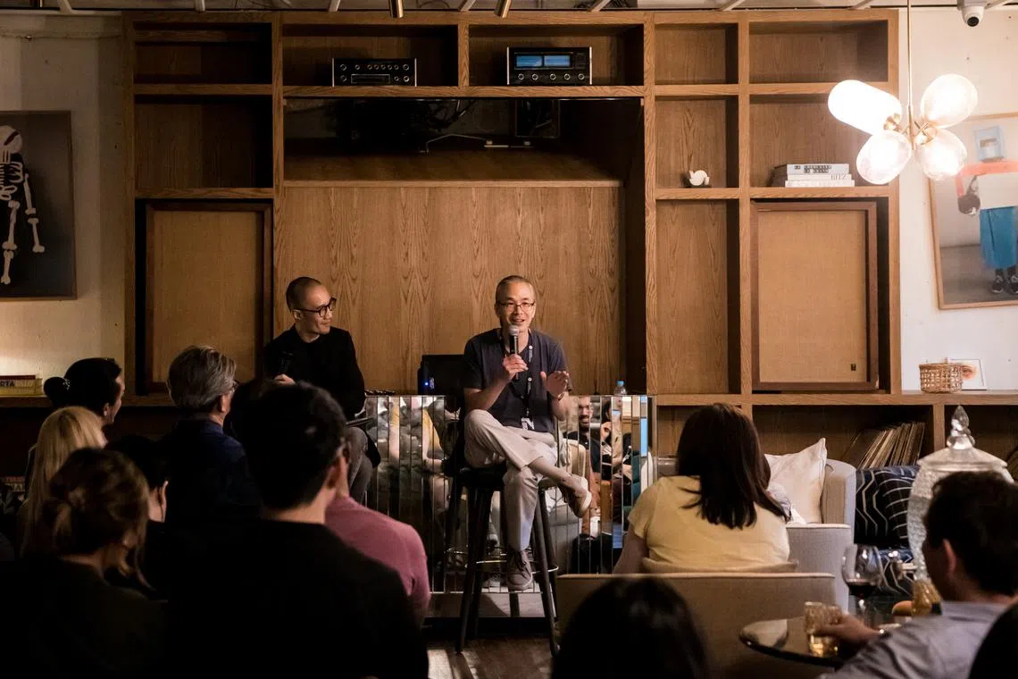 Ted Chiang (right) patiently discusses artificial intelligence and cryptocurrency