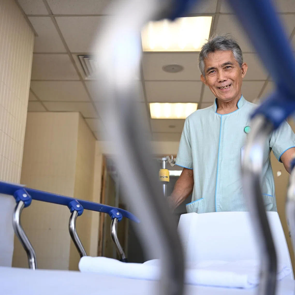 (pic by shintaro tay) Mr Muhamad Nor Bin Ali, 70, works as a healthcare porter with National University Hospital after securing employment with UEMS Solutions in January 2024.